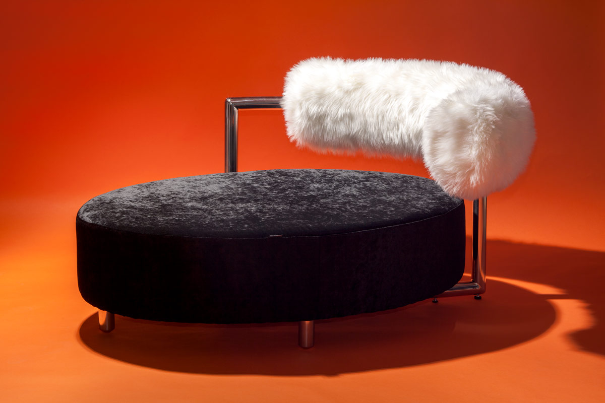 Madame Madame black chaise lounge with fluffy white rest and inox